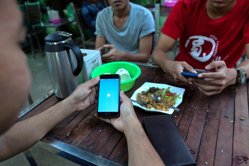 Rakhine netizens face a mobile internet block while dining at a teashop on February 20, 2020.