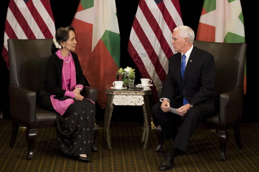 State Counsellor Daw Aung San Suu Kyi and United States Vice President Mr Mike Pence hold a bilateral meeting on the sidelines of an ASEAN Summit in Singapore on November 14. (AFP)