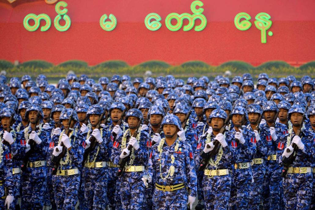 Soldiers march in formation during a parade to mark 74th Armed Forces Day in Nay Pyi Taw on March 27. (AFP)