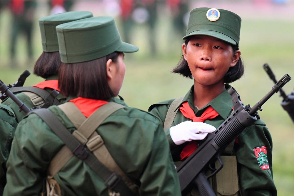 United Wa State Army soldiers wait to participate in a military parade. (AFP)