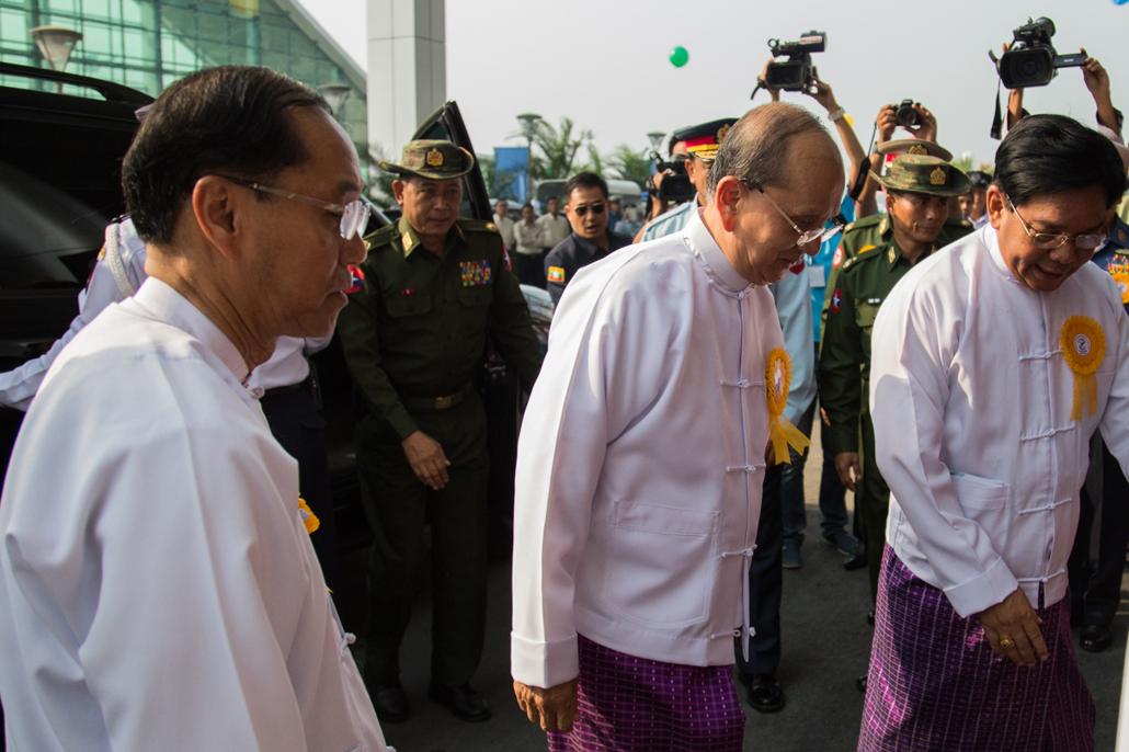 Former President U Thein Sein, centre, with Vice President U Myint Swe, at the opening of the new Yangon Airport terminal in March 2016. Myint Swe remains on the SDN list. The Asia World subsidiary that built the new terminal was added last month. (AFP)