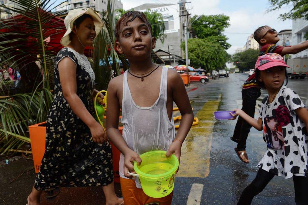 Revellers drenched in water during Thingyan celebrations in Yangon in April 2016. (AFP)