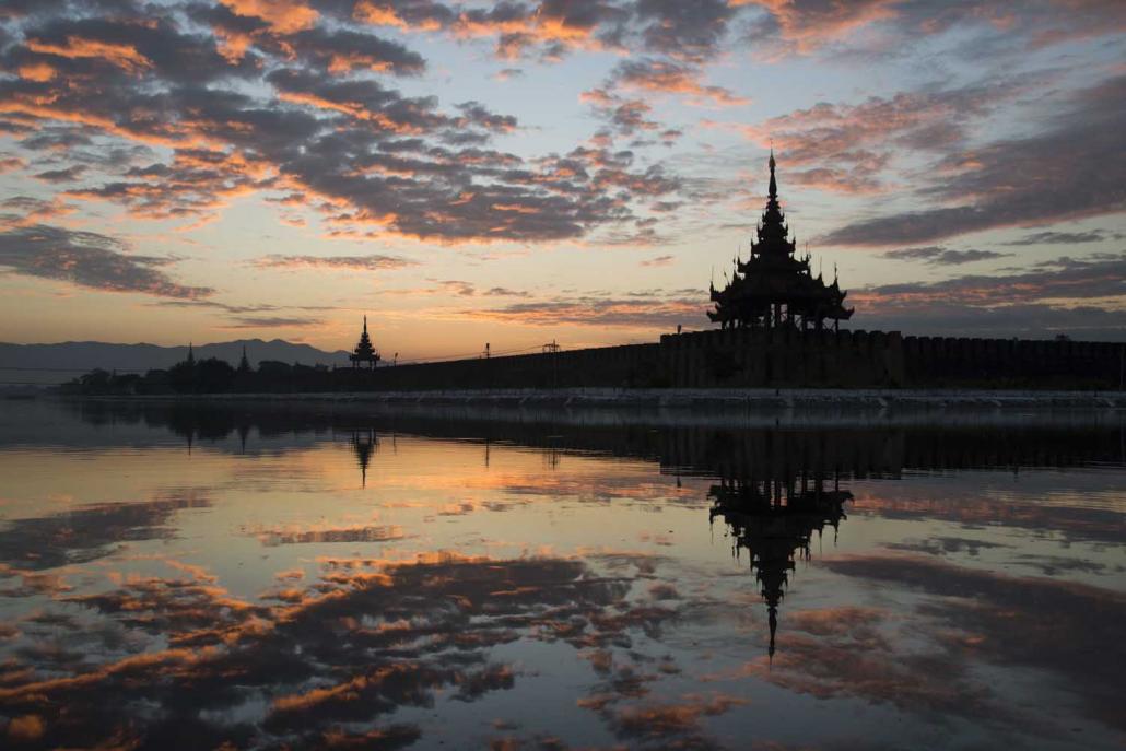 The sun rises over the royal palace in Mandalay. (AFP)