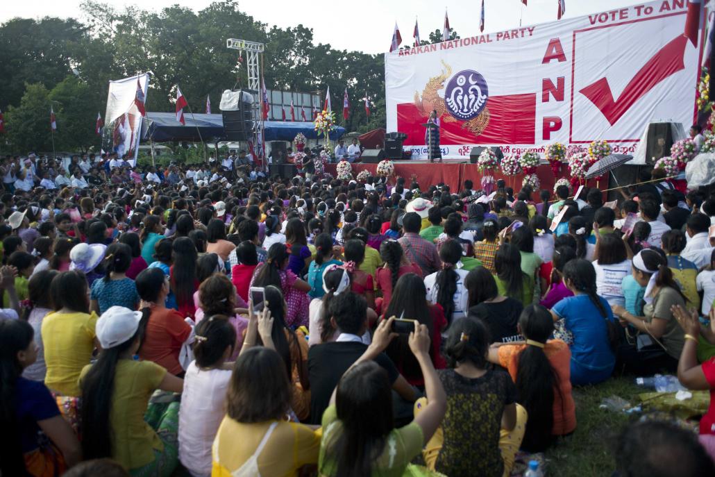 People attend an Arakan National Party campaign event in Yangon on October 25, 2015. The party was one of the most successful in that year's general election, winning 22 seats in the national parliament. (AFP)