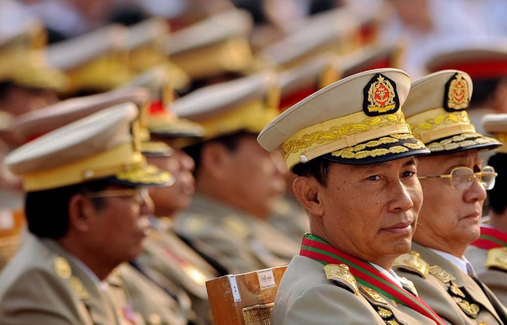 Shwe Mann and Thein Sein attend a military parade marking the country's 65th Armed Forces Day in Nay Pyi Taw on March 27, 2010. (AFP)