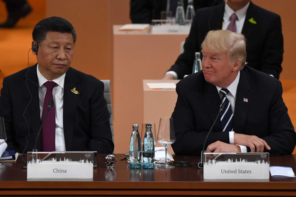 China's President Xi Jinping and US President Donald Trump attend a working session on the first day of the G20 summit in Hamburg, Germany, on July 7. (AFP)