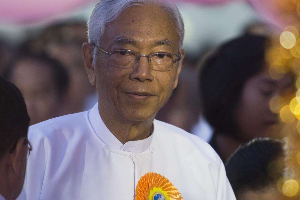 President U Htin Kyaw, whose office announced his resignation this morning, attends a New Year's ceremony at Shwedagon Pagoda on January 1. (AFP)