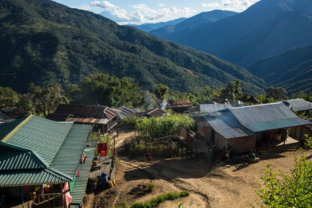 Houses in Kheng village, about two hours from Mindat. Many villages in Chin State lack basic health infrastructure and poor quality roads make accessing care difficult. (John Rae / UNOPS)