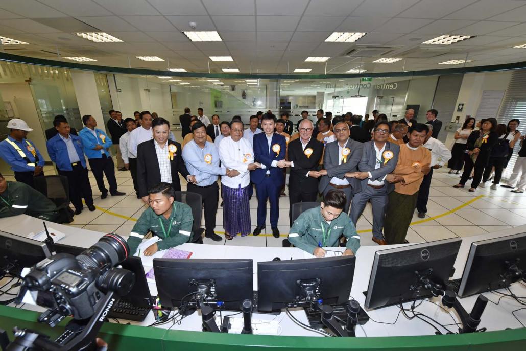 Officials in the control room at the opening ceremony of the Myingyan gas-fired power plant, which was developed by Singaporean company Sembcorp. (Supplied)