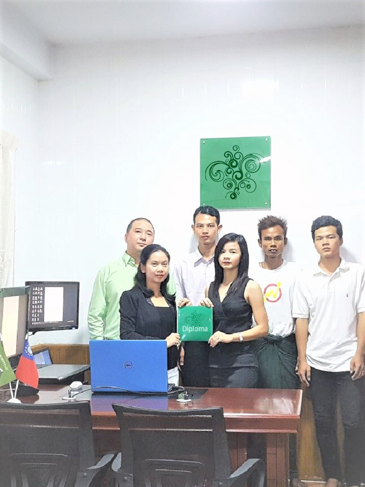 Myanmar office director, second from right, poses for a photo in Yangon (Facebook)