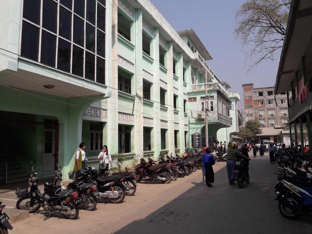 Students walk around the grounds of Phaung Daw Oo Monastic School. (Oliver Slow | Frontier)