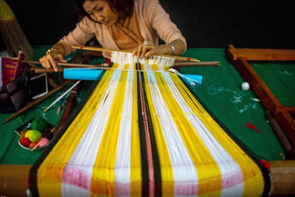 A cluster of weaving businesses from Amarapura have banded together to form the Myanmar Weaving Businesses Association to improve engagement with the authorities and other businesses, and keep the industry stable. (Thuya Zaw | Frontier)