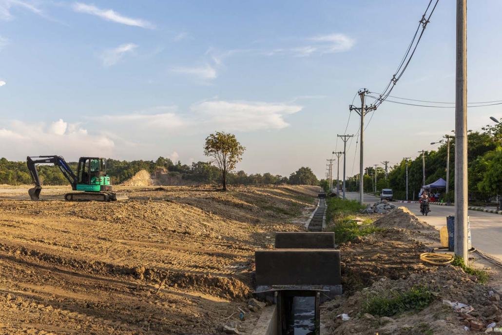 Heavy machinery clears land at a site in Nay Pyi Taw's Ottarathiri Township that will be sold to government officials. (Hkun Lat | Frontier)