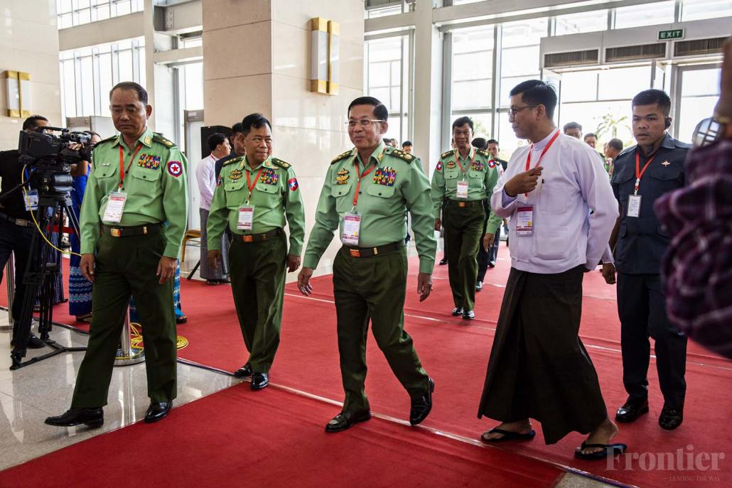 Senior General Min Aung Hlaing (centre) arrives at the event marking the fourth anniversary of the signing of the Nationwide Ceasefire Agreement. (Hkun Lat | Frontier)