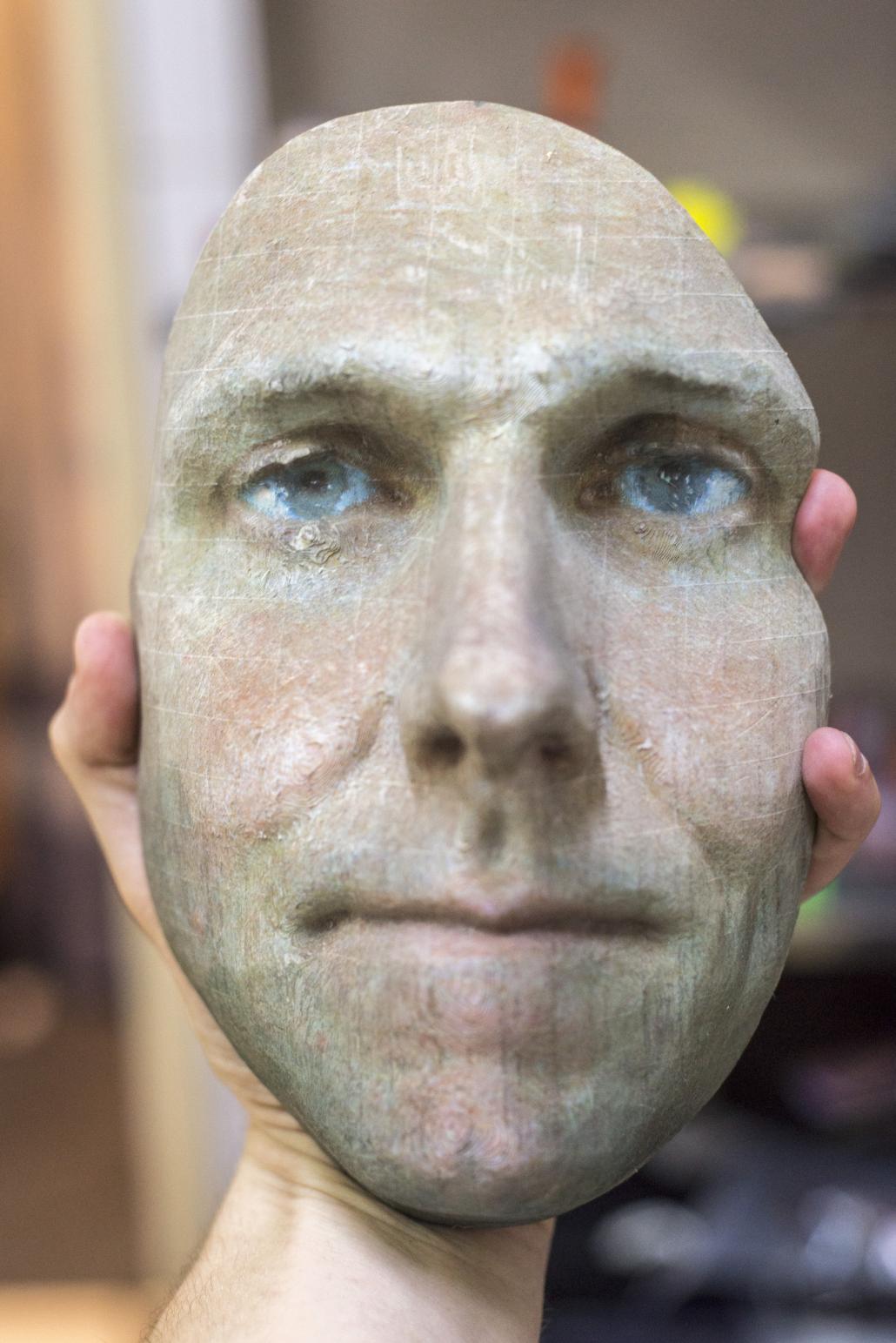 A paper replica of a human face printed by Life and Challenge. (Seb Higginson / Frontier)