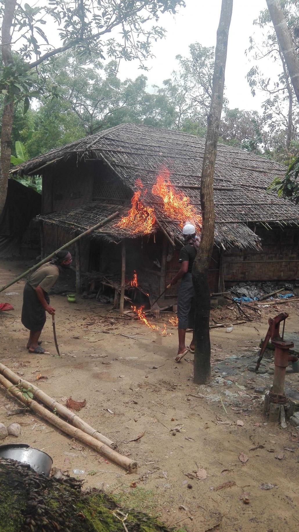 A photo provided to reporters that appeared to show Muslims burning their own homes. Evidence later emerged that the photos were staged. (Supplied)