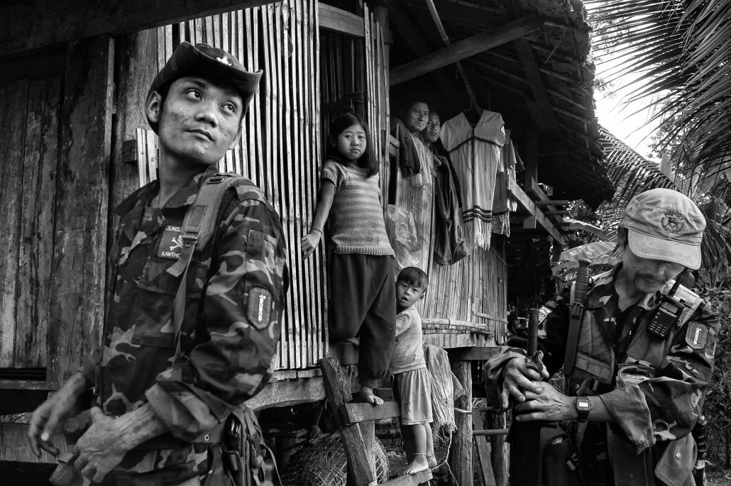 KNLA soldiers visit a village in Karen State. Ceasefires have paved the way for peace talks but a permanent solution to repatriating thousands of internally displaced persons and refugees has not been found. (Brennan O'Connor | Frontier)