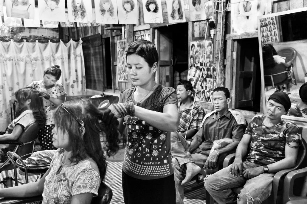 A hairdresser works at a salon in Nebule town, located in the Dawei Special Economic Zone. (Brennan O'Connor / Frontier)