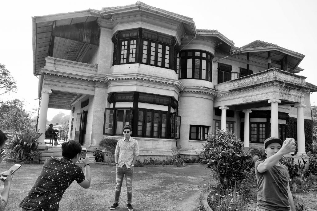 Tourists visit the Royal Palace in Hsipaw, also known as East Haw. Built in the early 20th century, its architecture was greatly influenced by British colonialism. (Brennan O'Connor / Frontier)