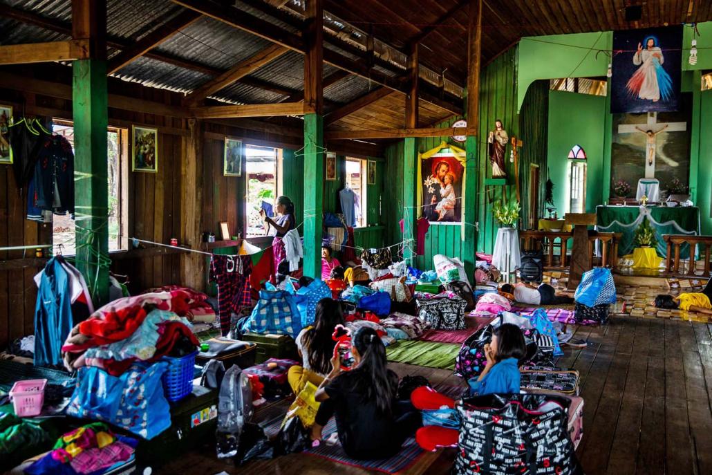 IDP students who have returned to Nam San Yang village sleep inside a Catholic church where they are temporarily staying. (Hkun Lat | Frontier)