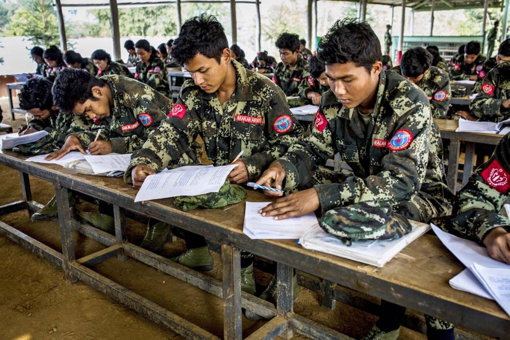 Arakan Army soldiers sit exams at the end of a three month advanced combat and platoon commander training programme in Laiza. (Hkun Lat | Frontier)