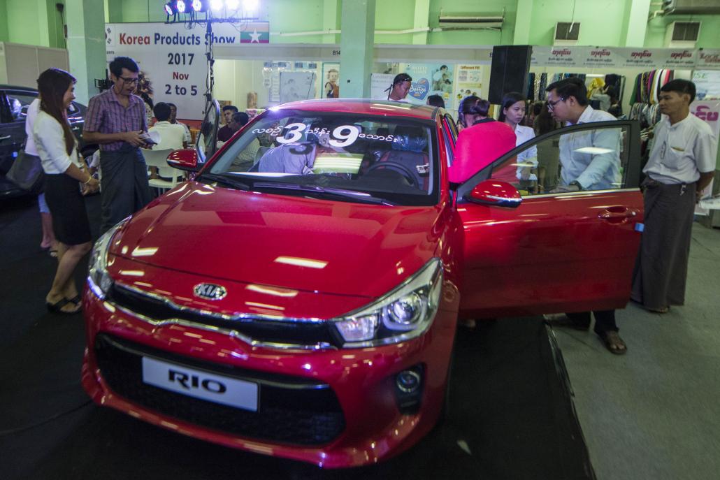 A Kia car on display at an exhibition at Yangon's Tatmadaw Hall. (Teza Hlaing | Frontier)