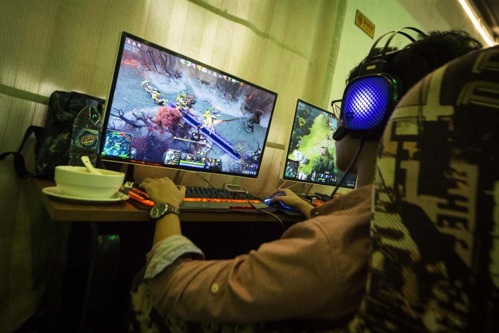 Probably the most popular title for Myanmar e-gamers is Dota 2, a fantasythemed strategy game and long-time favourite of the country's dim cyber cafés. (Teza Hlaing | Frontier)