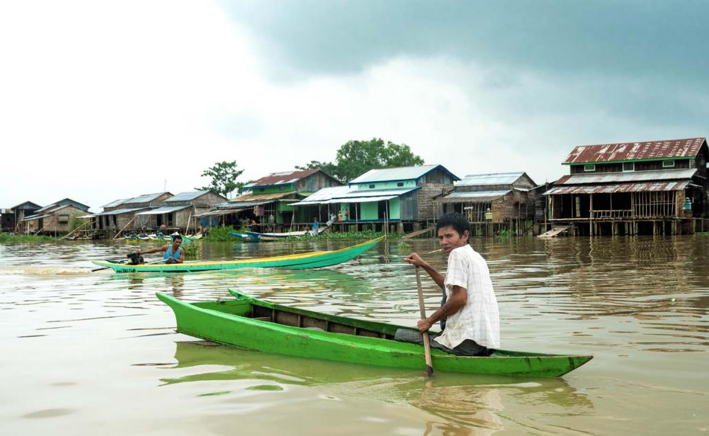 A man rows his boat in Dae Thin Yay Kyaw (Dominic Horner | Frontier)