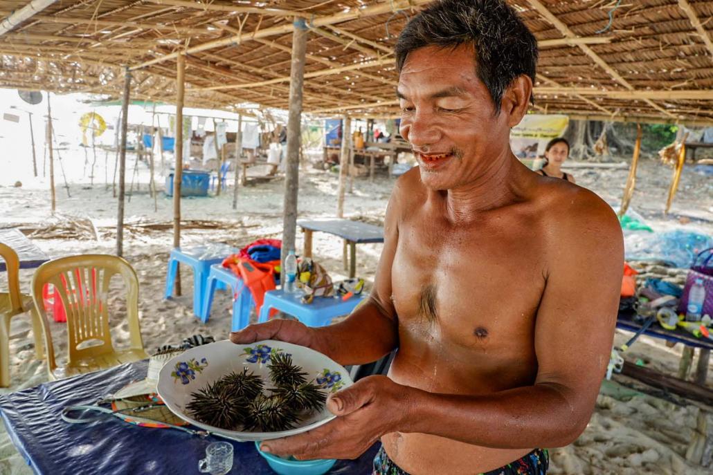 Preparing to tuck into a plate of fresh sea urchins on Yadanar Island. (Dominic Horner | Frontier)