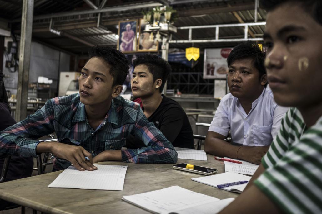 Students listen to a teacher from the Myanmar Mobile Education project. (Andre Malerba / Frontier)