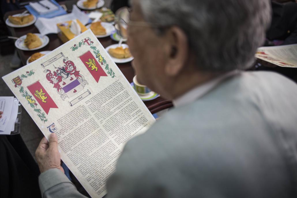 U David Abel with a copy of his family crest, which he purchased while on a visit to Scotland. (Ann Wang / Frontier)