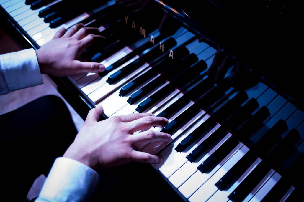 Ko Kevin Aung Moe Kyaw playing piano. (Ann Wang / Frontier)