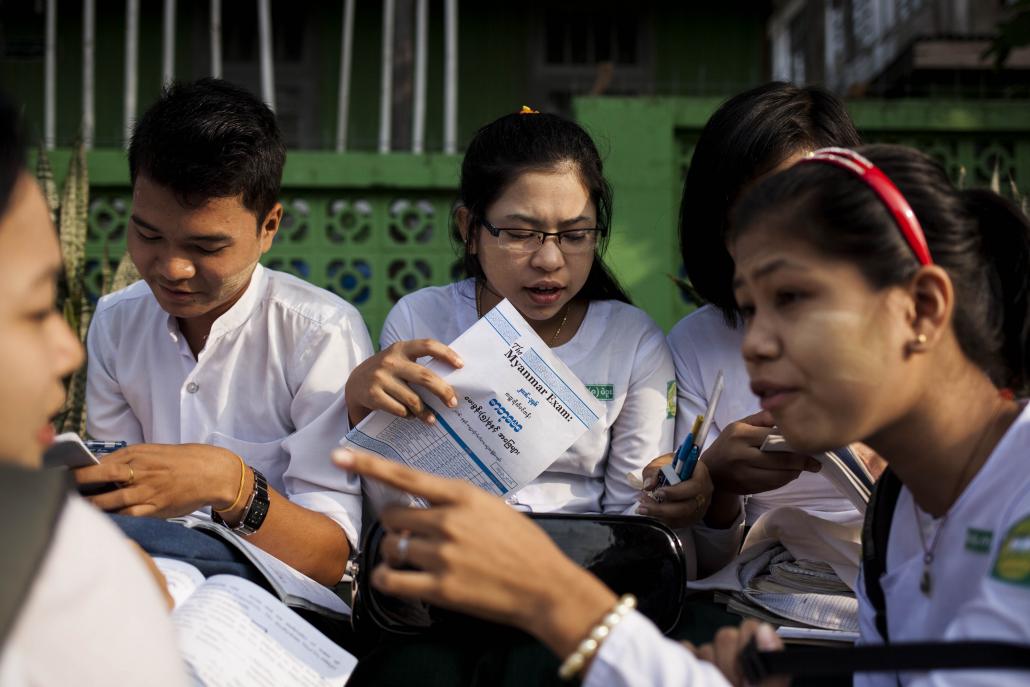 Ma Chaw Su Wai, centre, with her friends outside her school in Bago Region. (Ann Wang / Frontier)