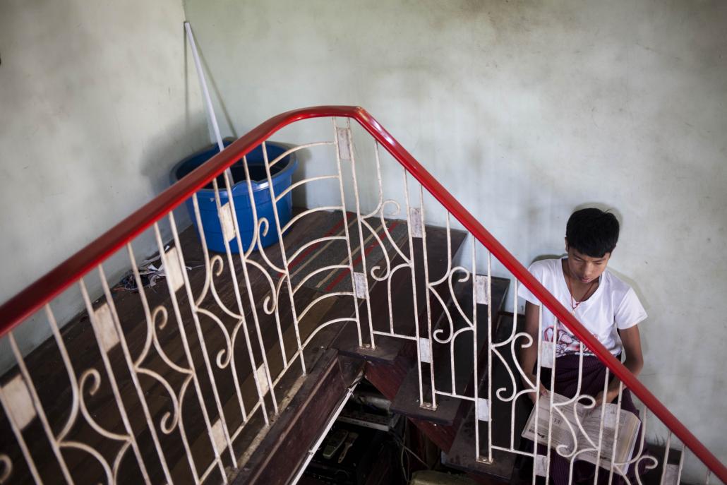 A student studies in the stairwell at BEHS 8 in Bago. (Ann Wang / Frontier)