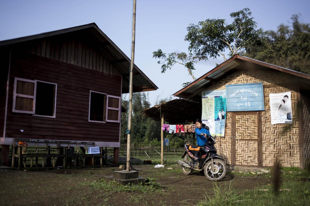 Daw Phyu Phyu Htwe, 33, travels around the local area by motorbike. She was sent to Zino village one year ago and is transferred to a new city every two years. (Ann Wang / Frontier)