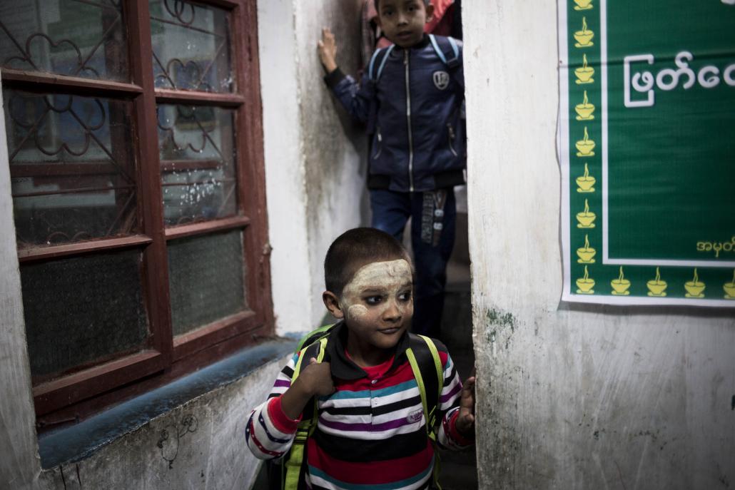 Students leave the Tawwin Yadana Myanmar School in Ruili, China. (Ann Wang / Frontier)