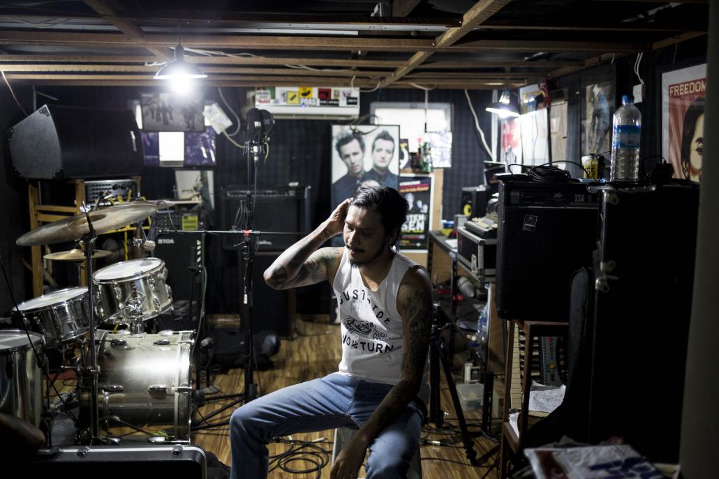 Musicians from the band No U Turn practise at their studio in Yankin. (Ann Wang / Frontier)