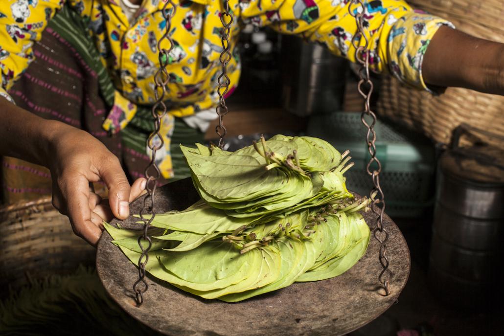 Betel leaves weighed at the market in Nyaung-U, Mandalay Region. (Chiara Luxardo / Frontier)