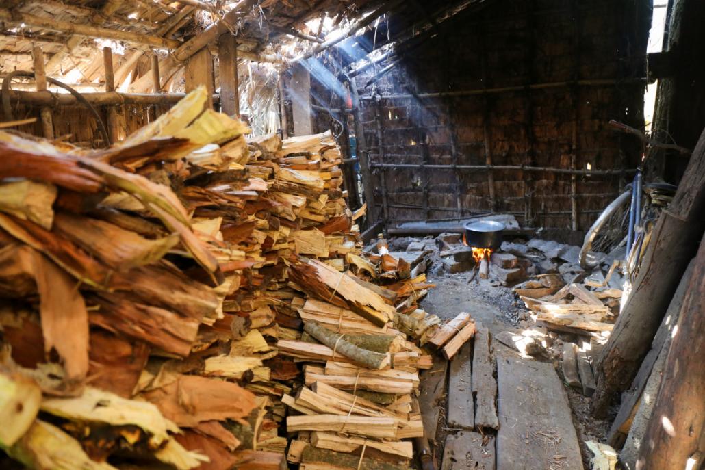 A mixture of mangrove and other wood near a brick kiln in the Irrawaddy region. Workers at the kilns say they prefer the finish on the charcoal made from mangrove. (Victoria Milko | Mongabay)