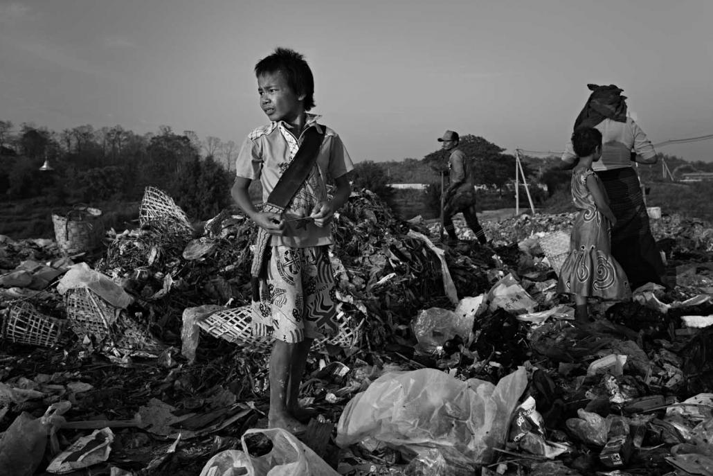 After work, Maung Naing Lin Oo often fossicks at a nearby rubbish dump for goods to resell. (Andre Malerba | Frontier)