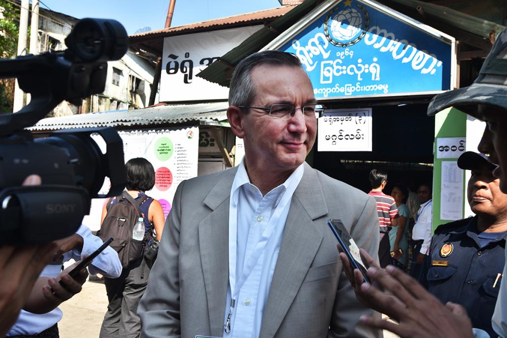 US ambassador to Myanmar Mr Scot Marciel speaks to the press after observing polling in Yangon's Tarmwe Township. ( (Steve Tickner | Frontier)