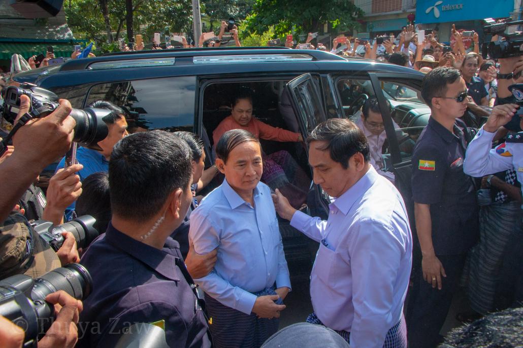 President U Win Myint arrives before a media scrum to vote in Tarmwe, Yangon. (Thuya Zaw | Frontier)