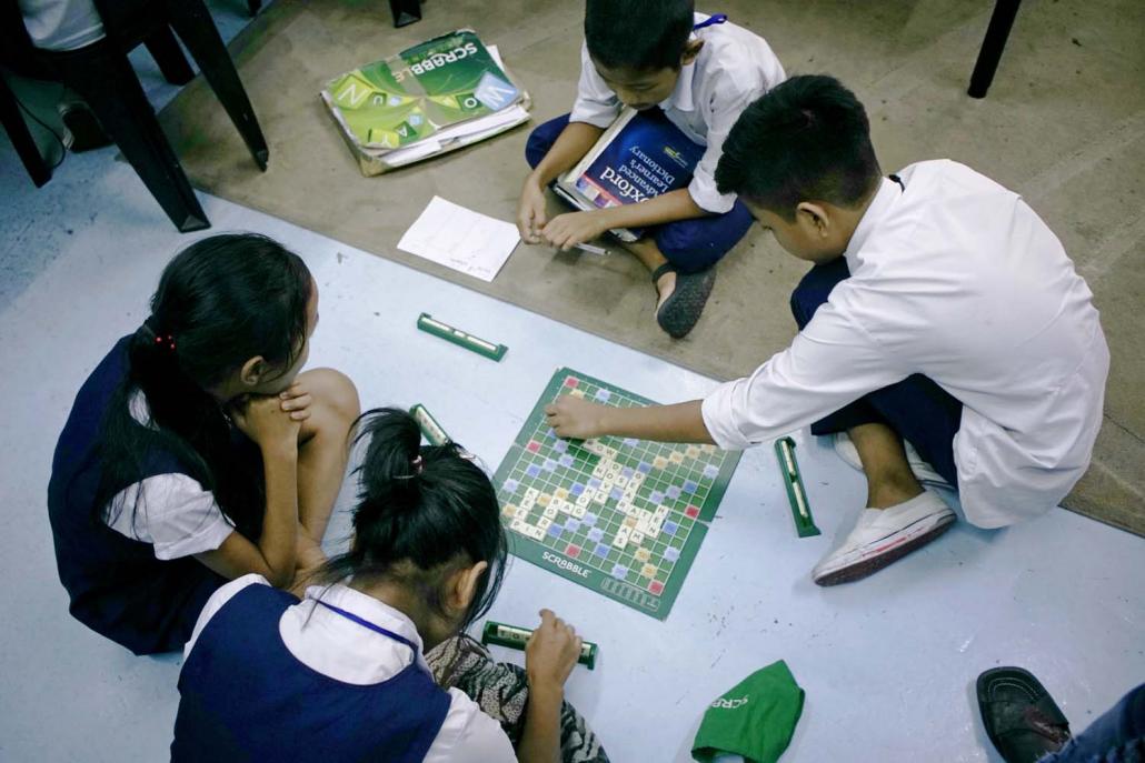 Ethnic Chin children play scrabble at the Cheras Learning Centre on the outskirts of Kuala Lumpur. Malaysia hosts almost 30,000 UN-recognised Chin refugees. (Eva Hirschi | Frontier)