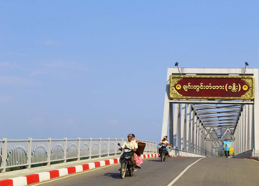 Motorcyclists cross the new bridge connecting Hkamti with the Naga Self- Administered Zone. (Oliver Slow | Frontier)