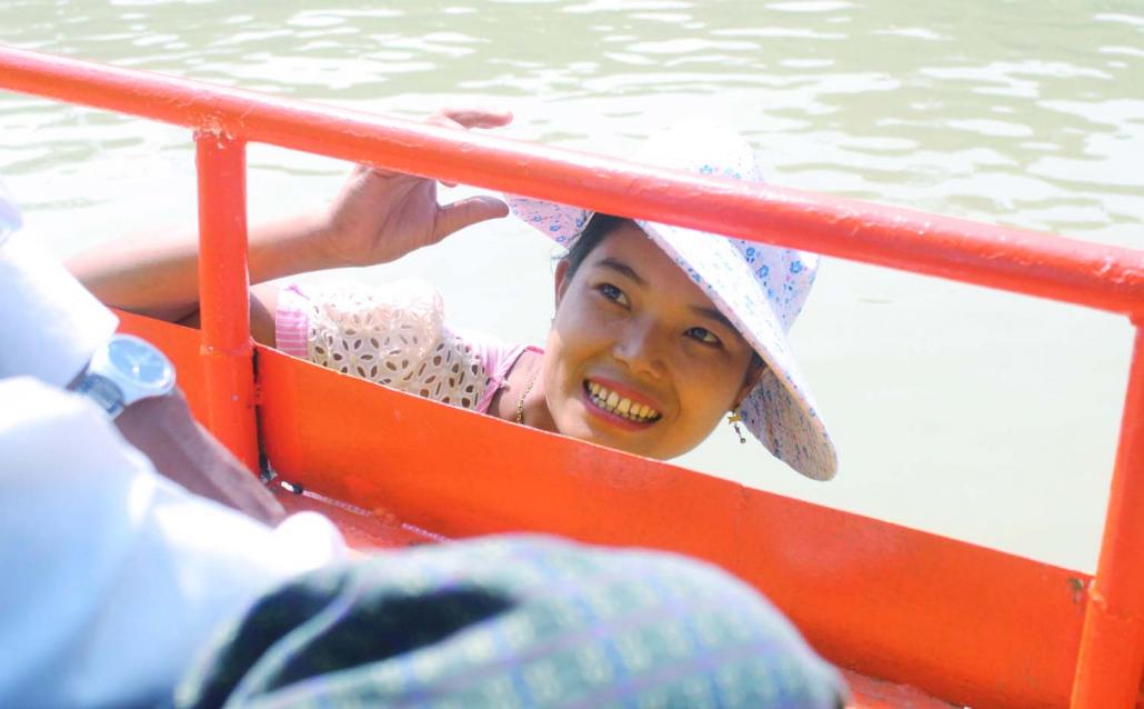 Ma Zaw Na Aye, who sells drinks and snacks on the boats that traverse the Chindwin River. (Oliver Slow | Frontier)