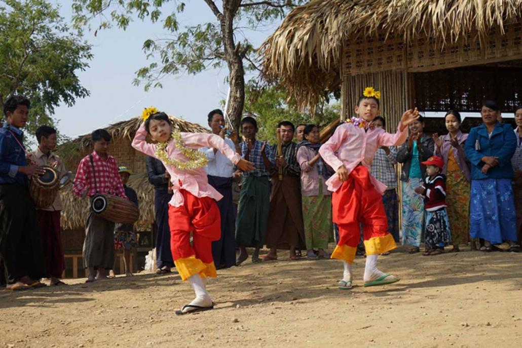 Visitors to the Myaing tourism project watch a dance performance. (Supplied)