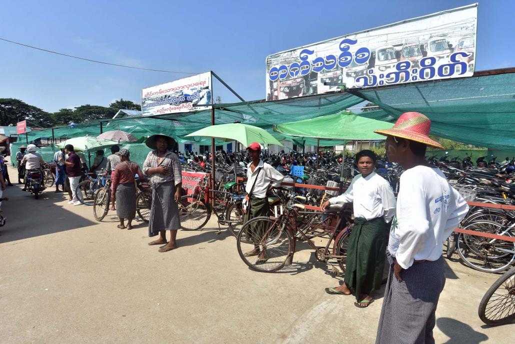 In Dala, the trishaw, motorbike and tuk tuk drivers who wait near the ferry terminal have organised themselves into informal groups. (Steve Tickner | Frontier)