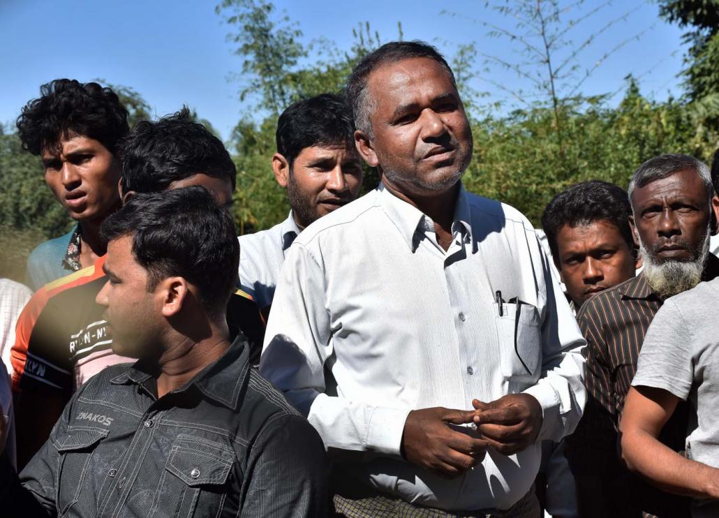 Dil Mohammed (centre) speaks to journalists at "No Man's Land" on the Myanmar-Bangladesh border, where around 5,000 people have sought refuge since August 2017. (Steve Tickner | Frontier)