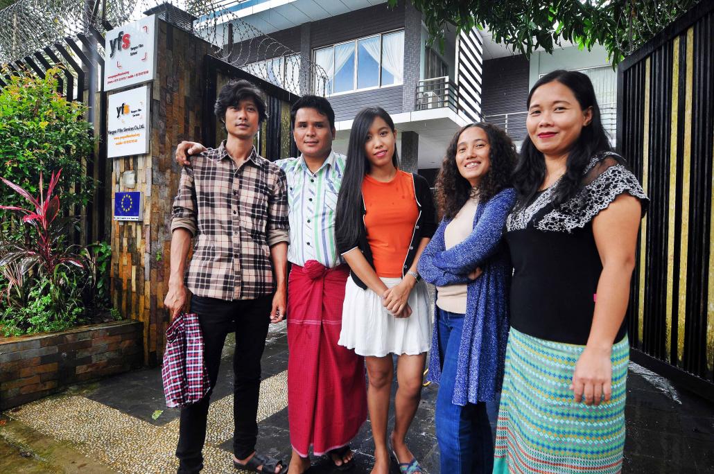 Sound engineer Kyaw Ko Ko, cinematographer Tin Win Naing, filmmakers Hnin Ei Hlaing and Shin Daewe, and film editor Htet Su Hlaing, left to right, outside the Yangon Film School. (Steve Tickner / Frontier)