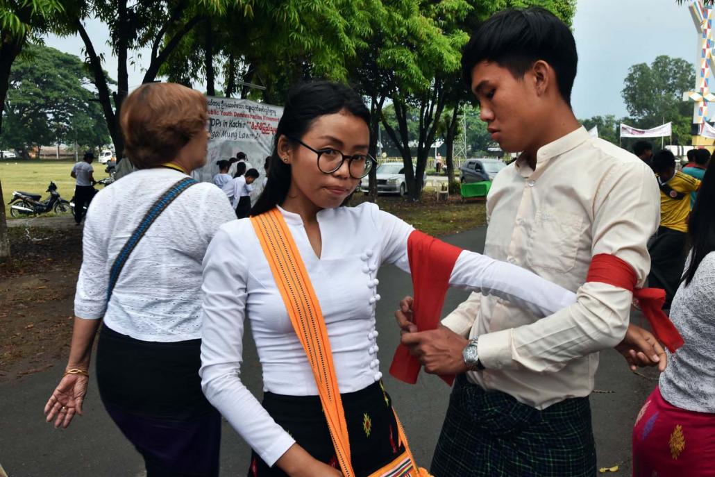 Supporters of the All Kachin Student Youth Union gather at the Manau Park in Myitkyina for a peace vigil calling on the government to protect civilians caught in the conflict zone in Kachin State. (Steve Tickner | Frontier)